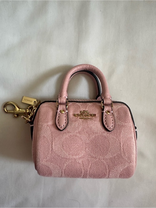 Coach Handbags - Coach pink denim mini Rowan charm